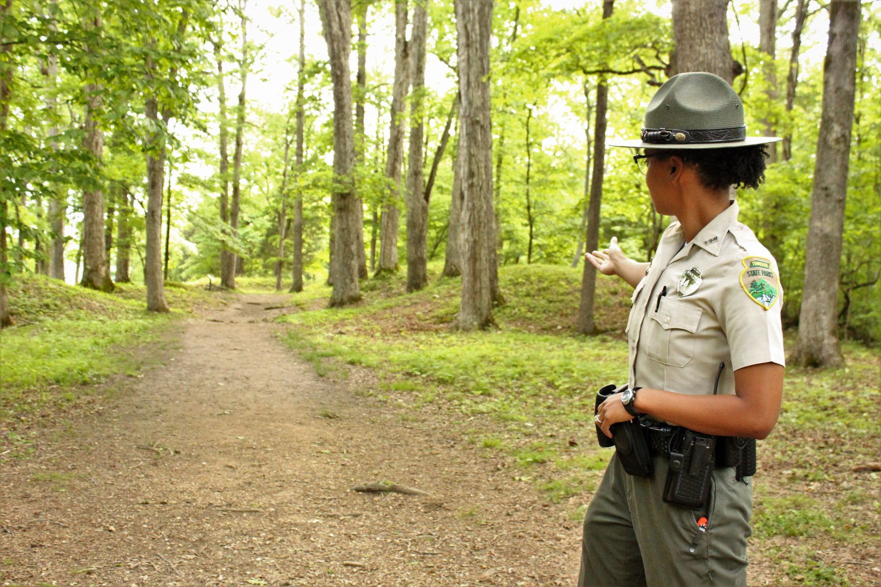 Leigh points to the two mounds.jpg